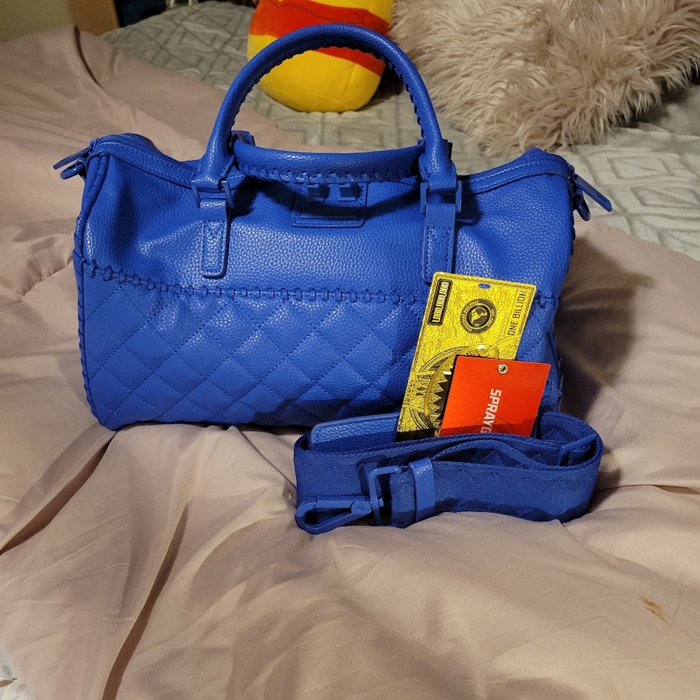 Blue sprayground duffle purse with crossbody strap